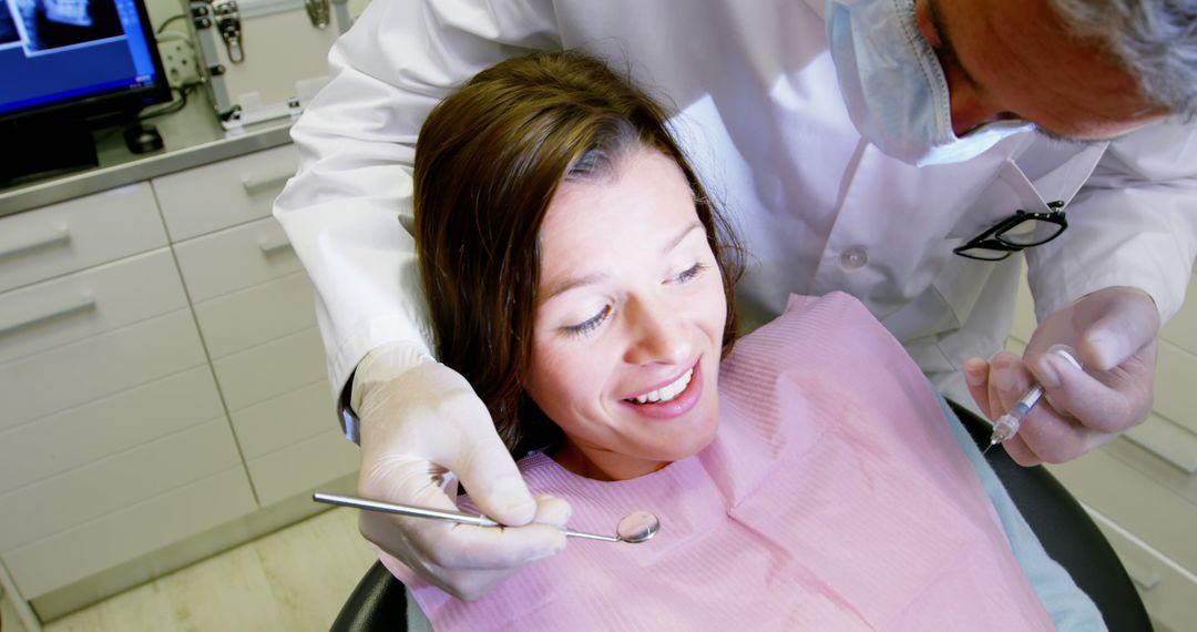 Female Patient Smiling During Dental Examination - Free Images, Stock Photos and Pictures on Pikwizard.com