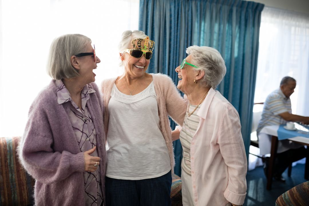 Senior Women Wearing Novelty Glasses Laughing Together - Free Images, Stock Photos and Pictures on Pikwizard.com