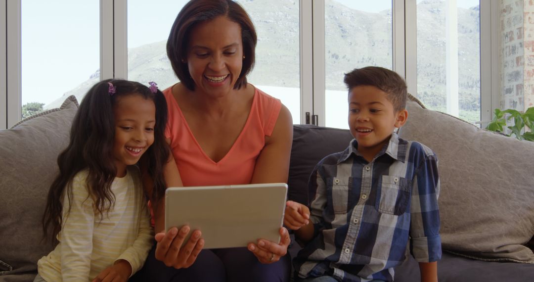 Happy Family Using Tablet in Bright Living Room - Free Images, Stock Photos and Pictures on Pikwizard.com