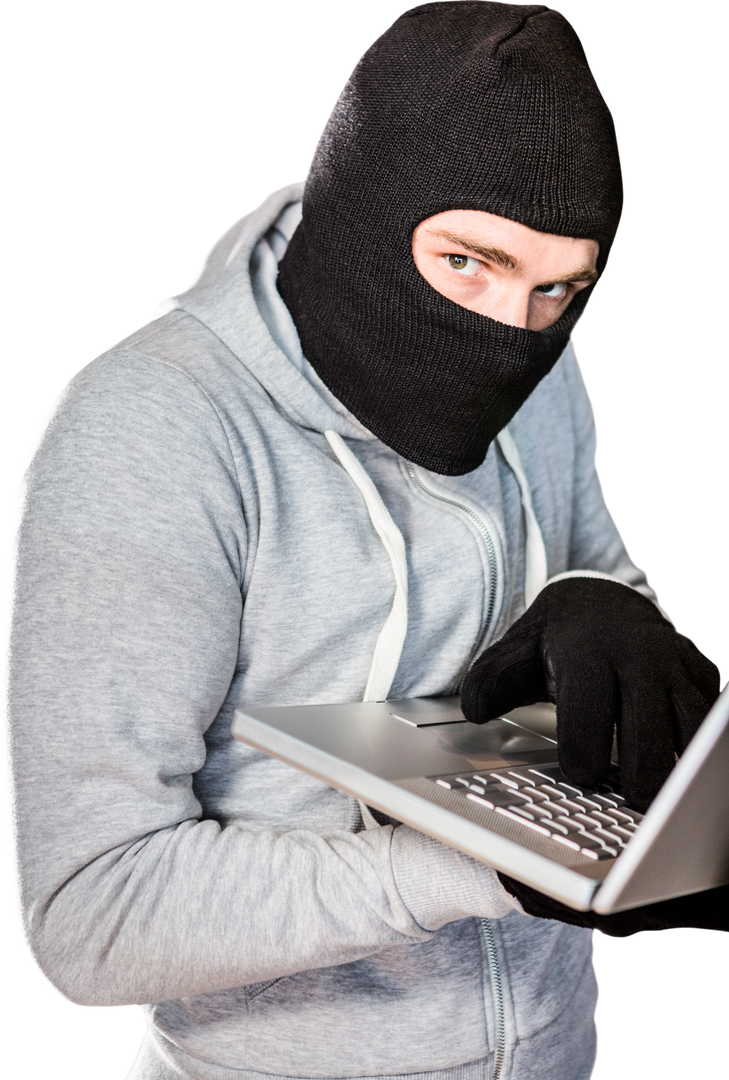 Burglary Concept: Masked Young Male Working on Laptop in Black Clothes - Download Free Stock Images Pikwizard.com