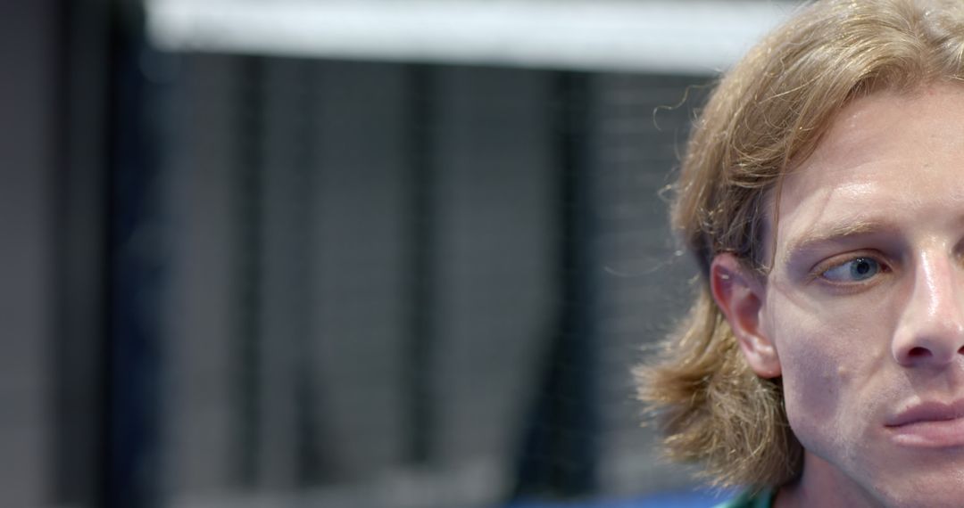 Determined Male Athlete in Gym Environment with Copy Space