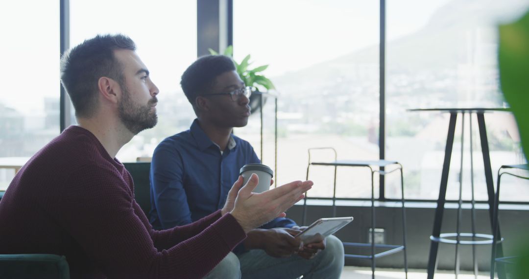 Diverse Professionals Engaged in Discussion with Natural Light