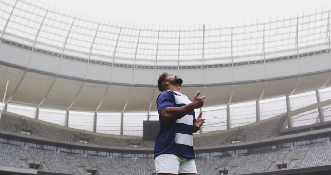 Rugby Player Celebrating in Empty Stadium, Raising Arms in Triumph - Free Images, Stock Photos and Pictures on Pikwizard.com