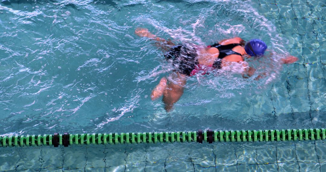 Female Swimmer Practicing Freestyle Stroke in Swimming Pool - Free Images, Stock Photos and Pictures on Pikwizard.com