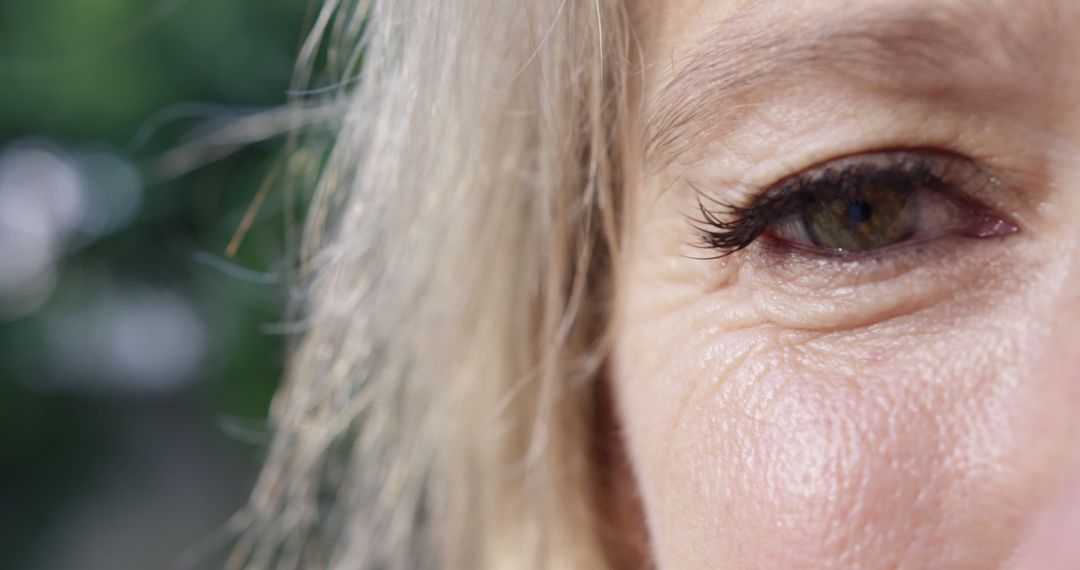 Close-Up of Elderly Woman's Eye with Wrinkles and Lashes - Free Images, Stock Photos and Pictures on Pikwizard.com