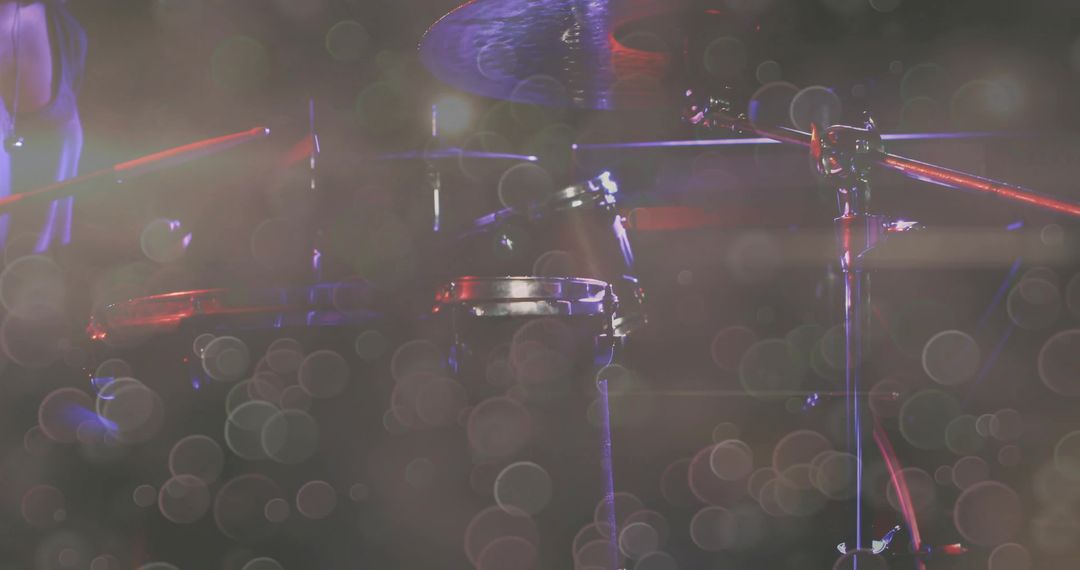 Vibrant Drum Kit on Stage with Hazy Red Spotlights
