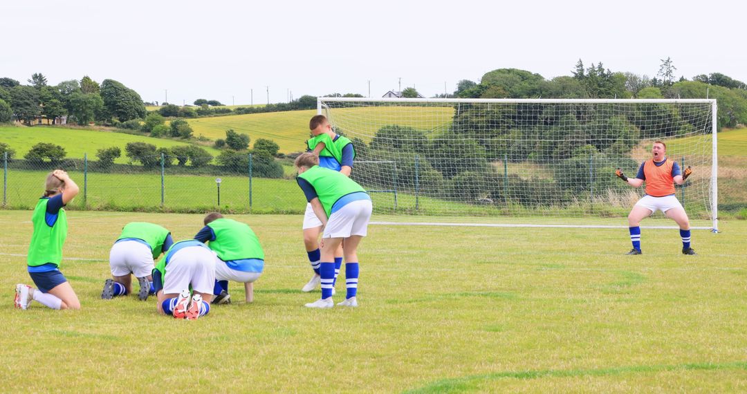 Youth Soccer Team Practicing on Rural Field