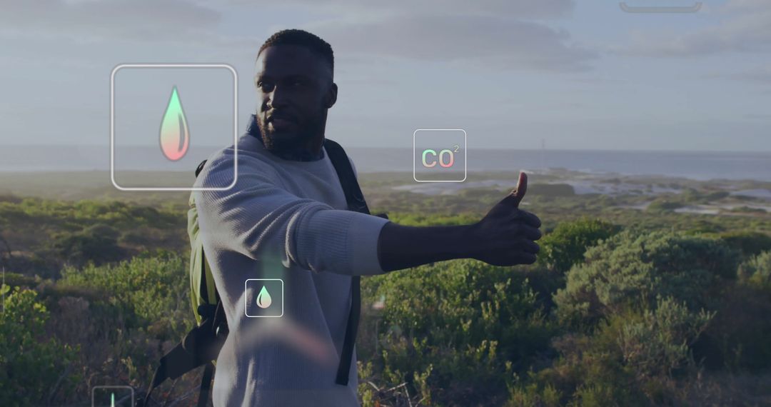 Man Analyses Environmental Data with Technology While Hiking