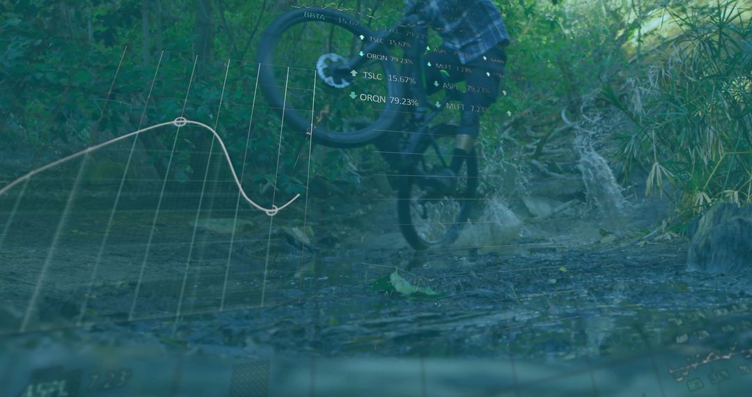Mountain Biker Performing Wheelie on Muddy Trail with Data Overlay