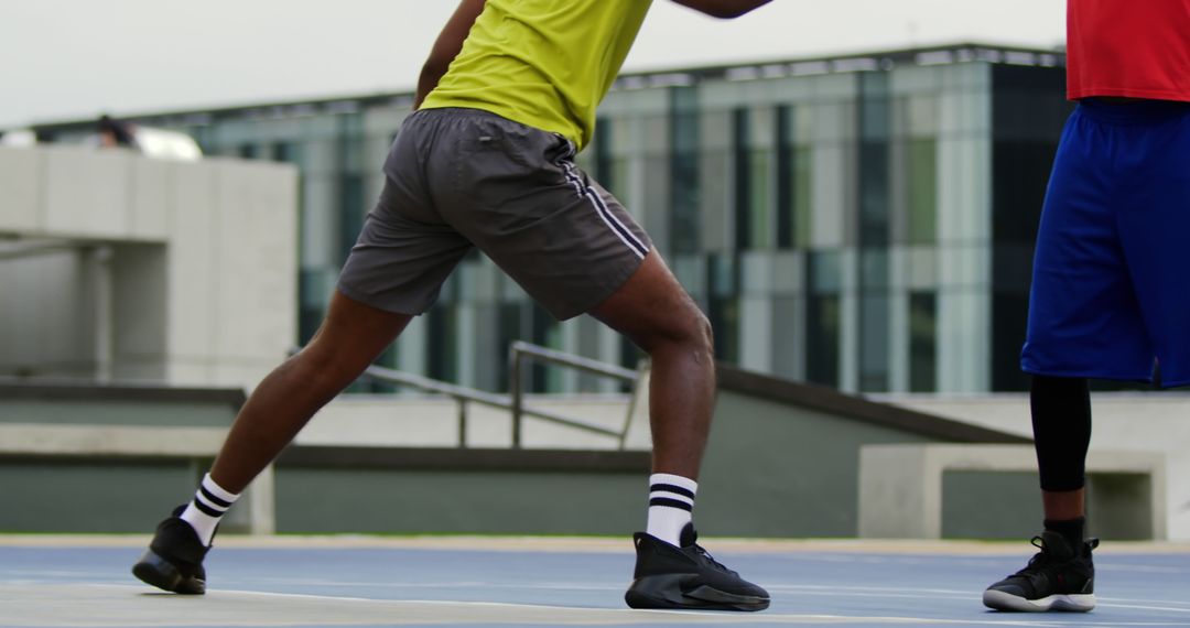 Basketball Players Training on Outdoor Court - Free Images, Stock Photos and Pictures on Pikwizard.com