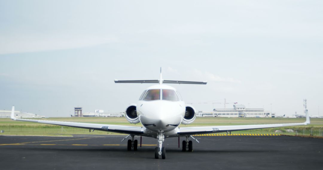 A private jet is parked on the tarmac, with copy space - Free Images, Stock Photos and Pictures on Pikwizard.com