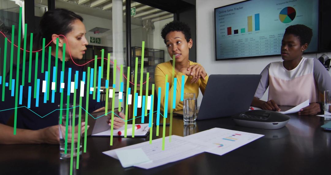 Diverse Female Team Analyzing Data in Modern Office Meeting