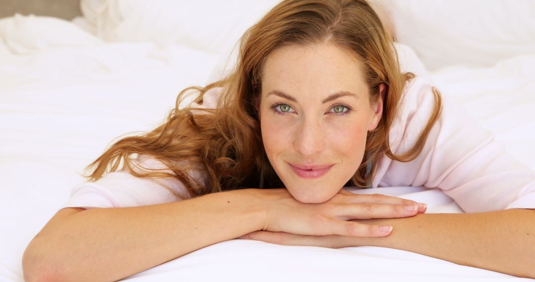 Smiling Woman Relaxing on Bed with White Linens - Free Images, Stock Photos and Pictures on Pikwizard.com