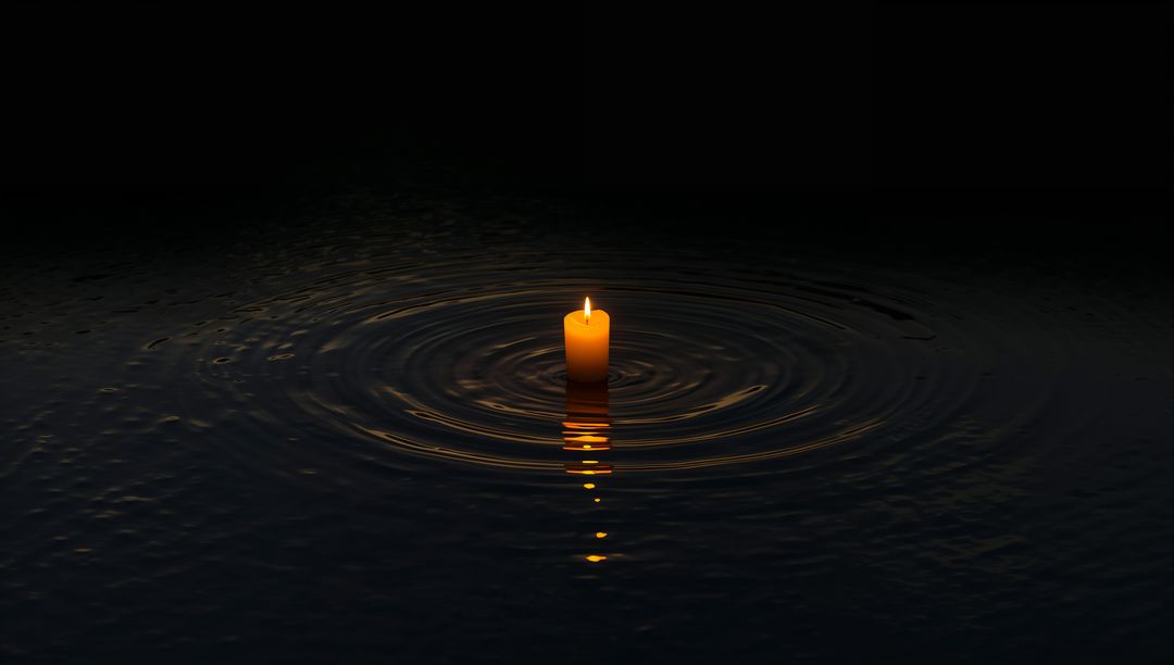 Floating Lit Candle Casting Golden Reflection and Ringed Ripples on Dark Water
