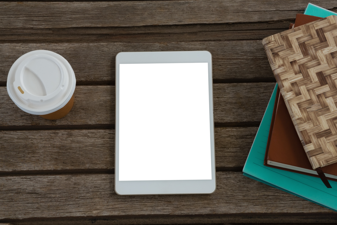 Transparent Digital Tablet with Coffee and Books on Wooden Plank - Download Free Stock Images Pikwizard.com