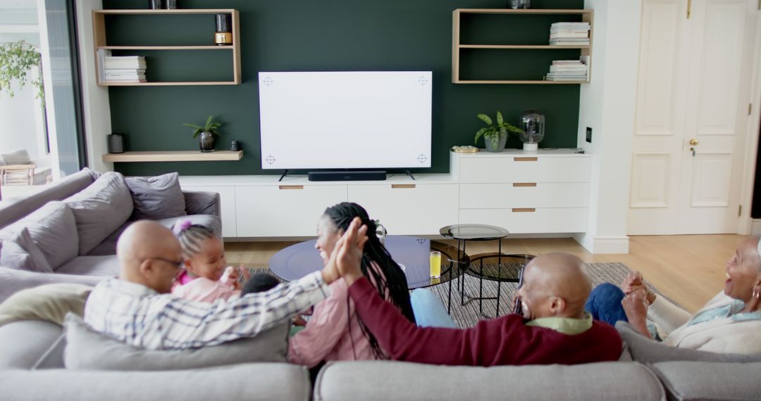 Family Watching TV Together in Modern Living Room - Free Images, Stock Photos and Pictures on Pikwizard.com