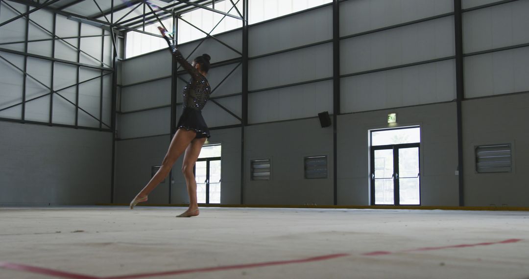 Young Gymnast Performing Dance Routine in Large Indoor Gym - Free Images, Stock Photos and Pictures on Pikwizard.com