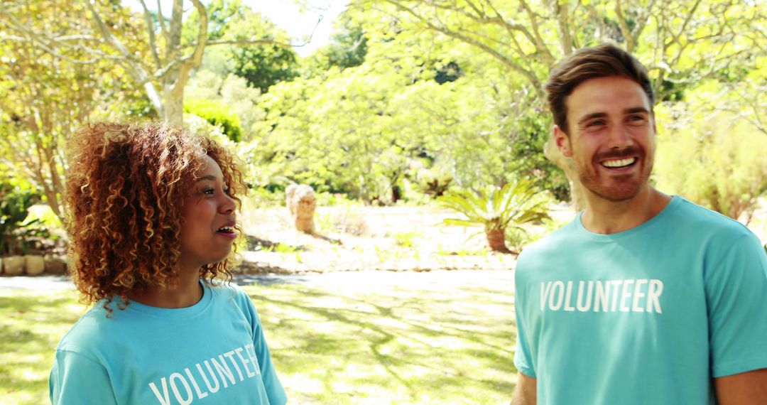 Diverse Volunteers Smiling in Park on Sunny Day - Free Images, Stock Photos and Pictures on Pikwizard.com