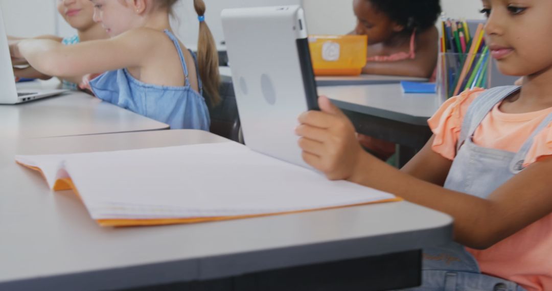 Diverse Schoolchildren Using Tablets in Classroom