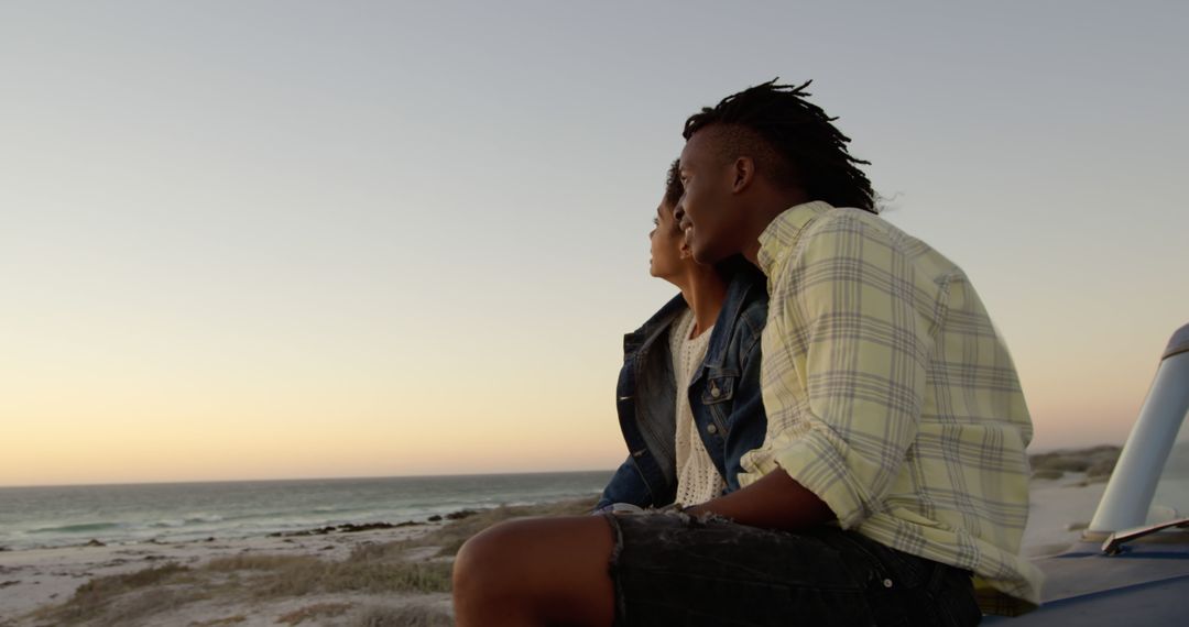 Couple Enjoying Sunset at Beach - Free Images, Stock Photos and Pictures on Pikwizard.com