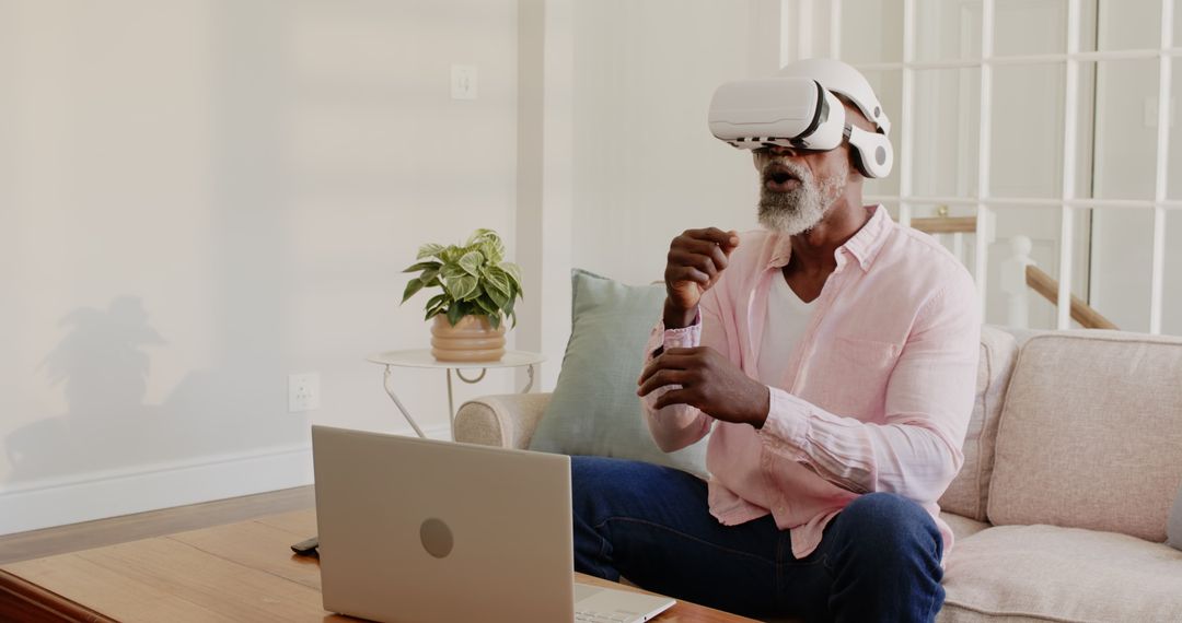Man Embracing Virtual Reality at Home on Laptop for Immersive Experience