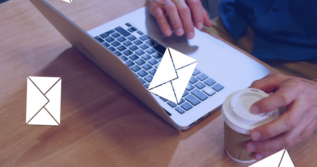 Man Checking Emails on Laptop with Coffee Cup