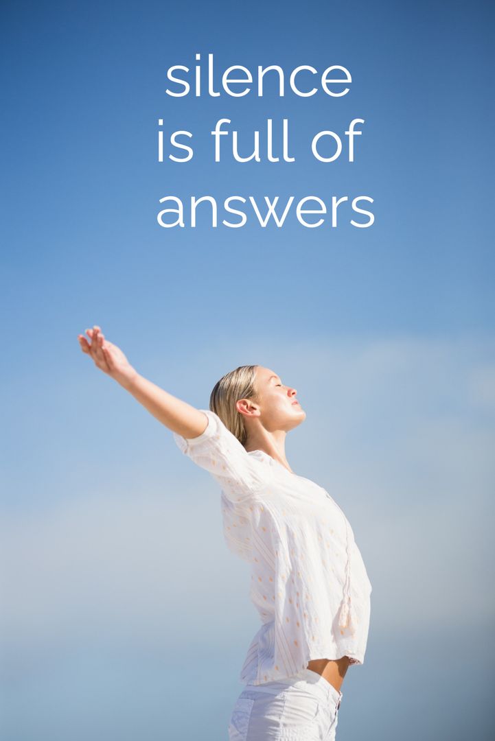 Woman Embracing Peace with Open Arms Against Clear Blue Sky