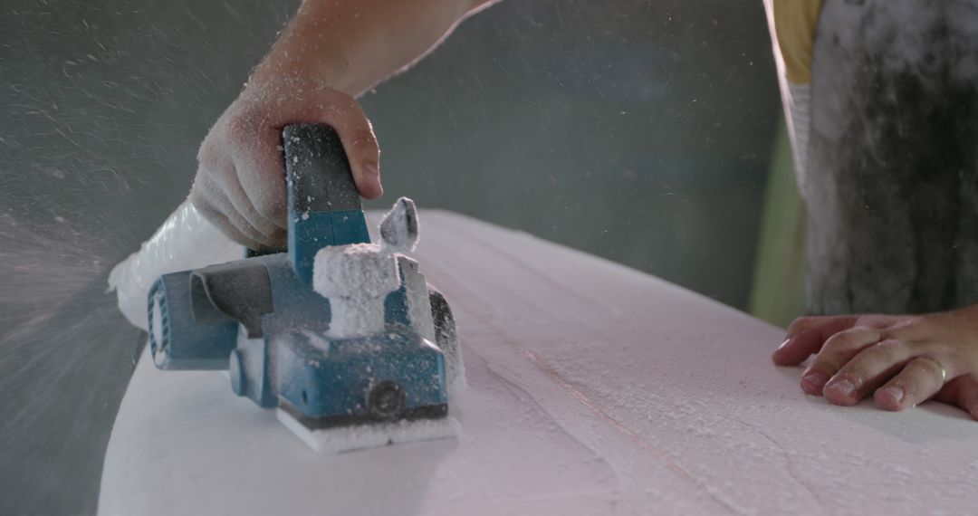 Craftsman Shaping Surfboard with Electric Planer - Free Images, Stock Photos and Pictures on Pikwizard.com