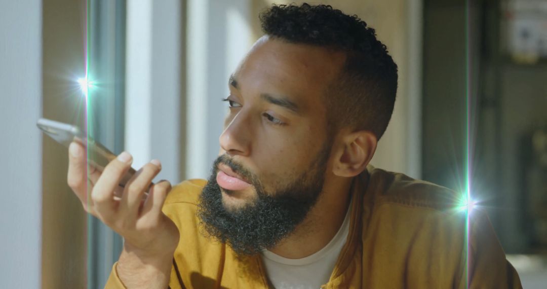 Bearded Creative Professional Using Smartphone Voice Command