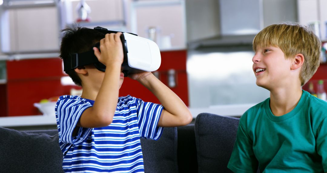 Two Boys Exploring Virtual Reality at Home - Free Images, Stock Photos and Pictures on Pikwizard.com