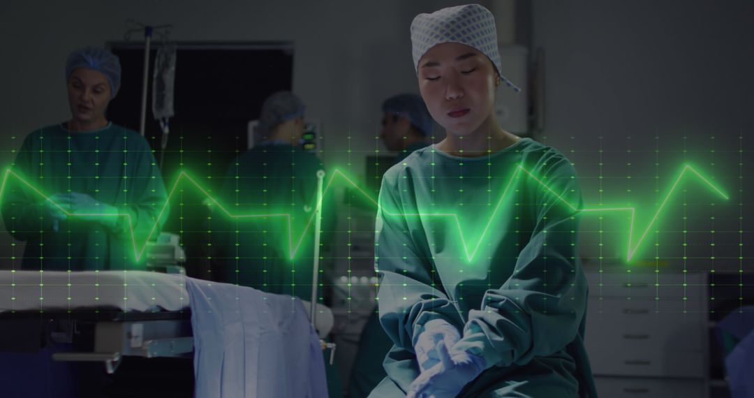 Focused Asian Surgeon with Digital Cardiograph Overlay in Operating Room