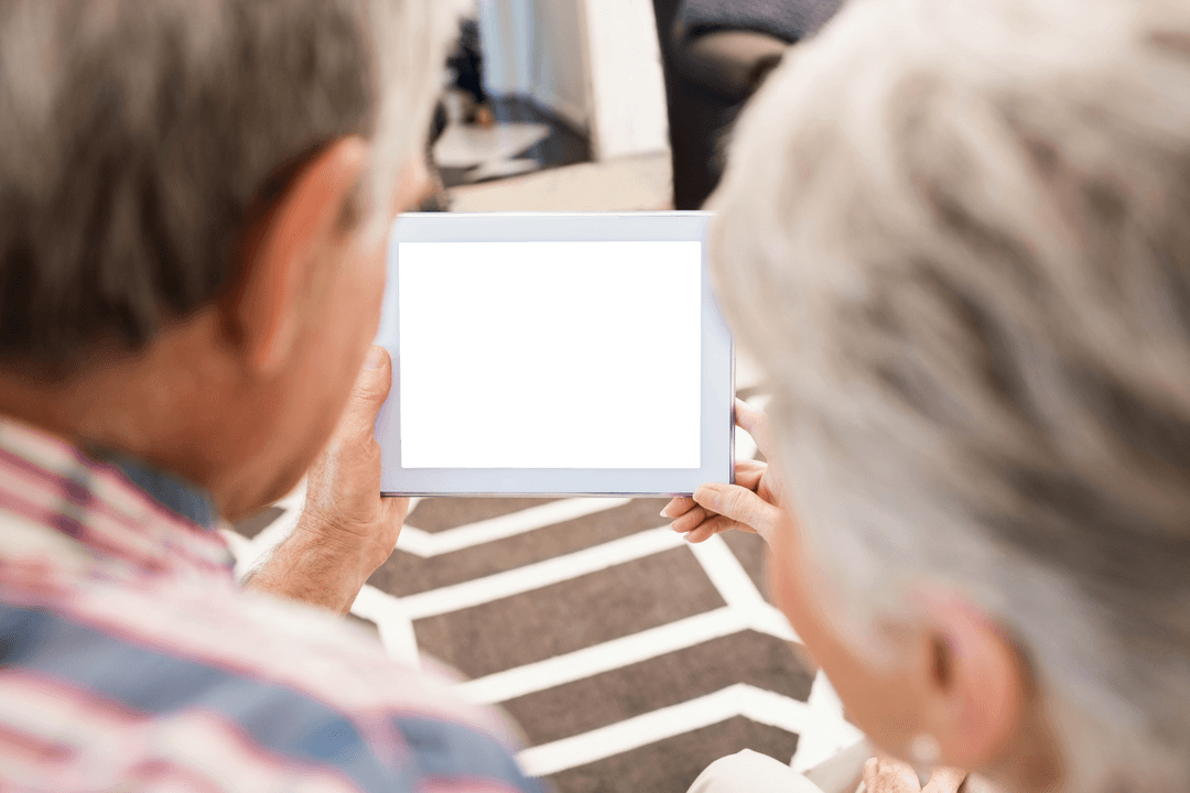 Senior Couple Using Tablet with Blackboard Screen Transparent