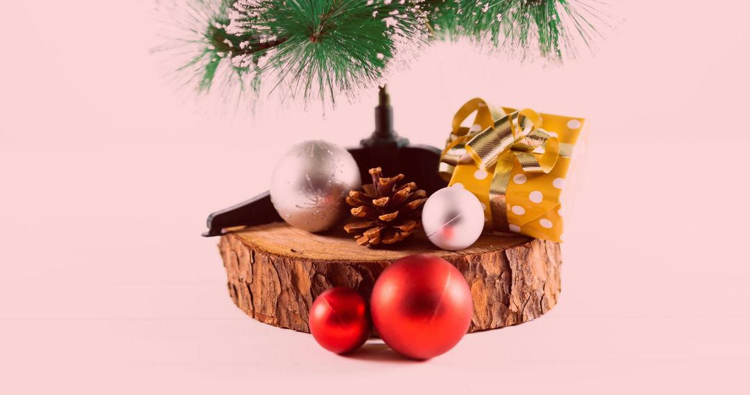 Festive Display of Christmas Ornaments Under Tree Branch