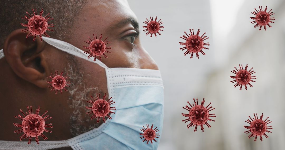 Man with Face Mask Amidst Floating COVID-19 Cells