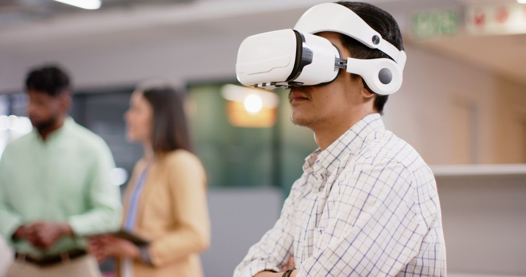 Man Using Virtual Reality Headset in Innovative Office