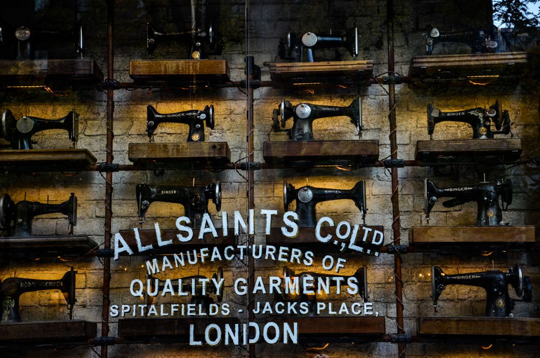 Vintage Sewing Machines Display at AllSaints Storefront - Free Images, Stock Photos and Pictures on Pikwizard.com