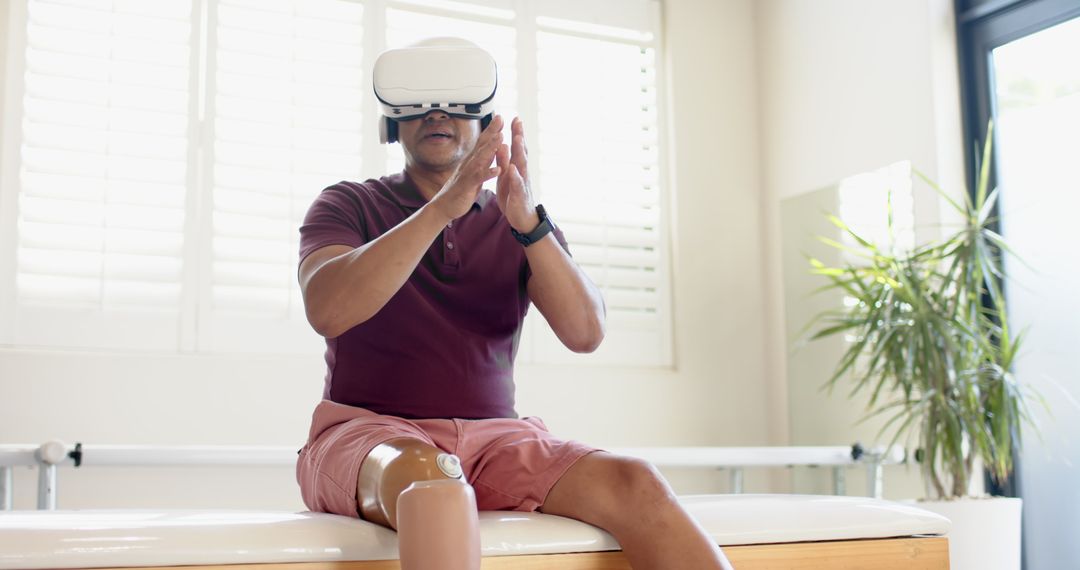 Man Using VR Headset for Prosthetic Leg Rehabilitation in Therapy Room