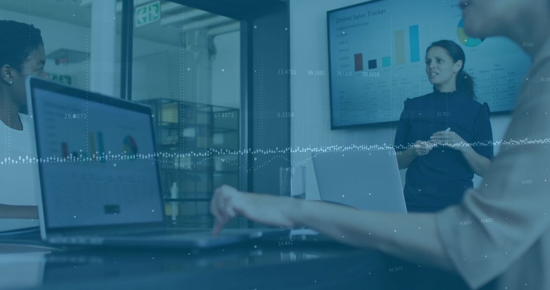 Modern Business Meeting with Data Analytics Presentation in Office