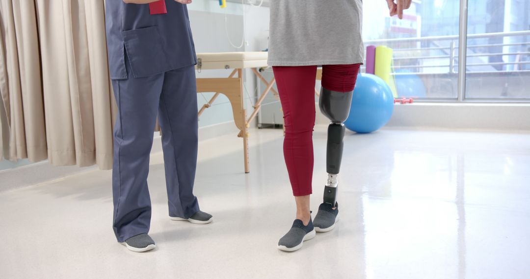 Physiotherapist Assisting Patient with Prosthetic Leg During Rehabilitation - Free Images, Stock Photos and Pictures on Pikwizard.com