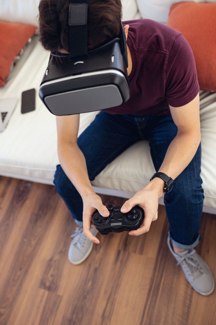 Teenage Boy Using Virtual Reality Headset While Gaming at Home - Free Images, Stock Photos and Pictures on Pikwizard.com