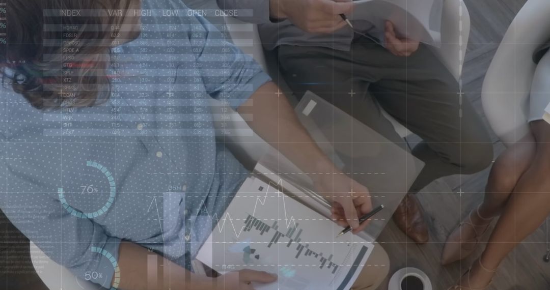 Business Team Analyzing Data with Digital Graphics on Documents