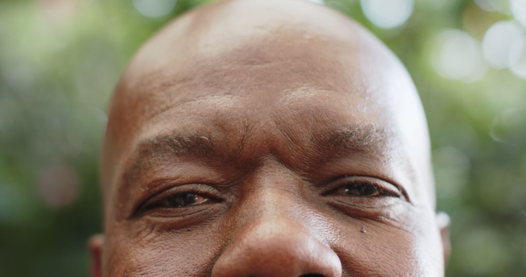 Close-Up of African American Shopkeeper Smiling Outdoors - Free Images, Stock Photos and Pictures on Pikwizard.com