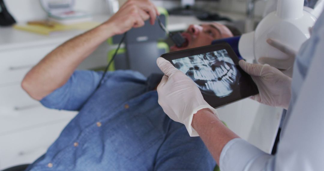 Dentist Capturing Patient's Dental X-ray with Modern Equipment - Free Images, Stock Photos and Pictures on Pikwizard.com