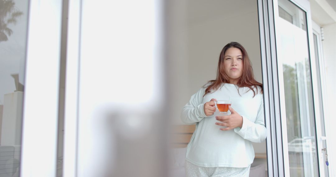 Plus Size Woman Enjoying Morning Tea at Open Bedroom Window