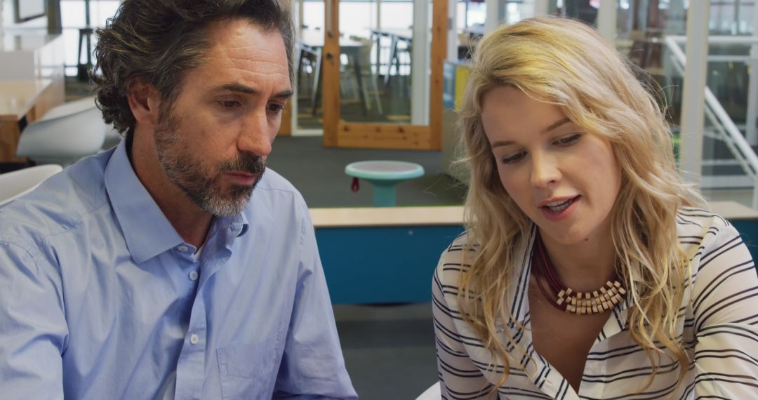 Caucasian Colleagues Collaborating in Modern Office