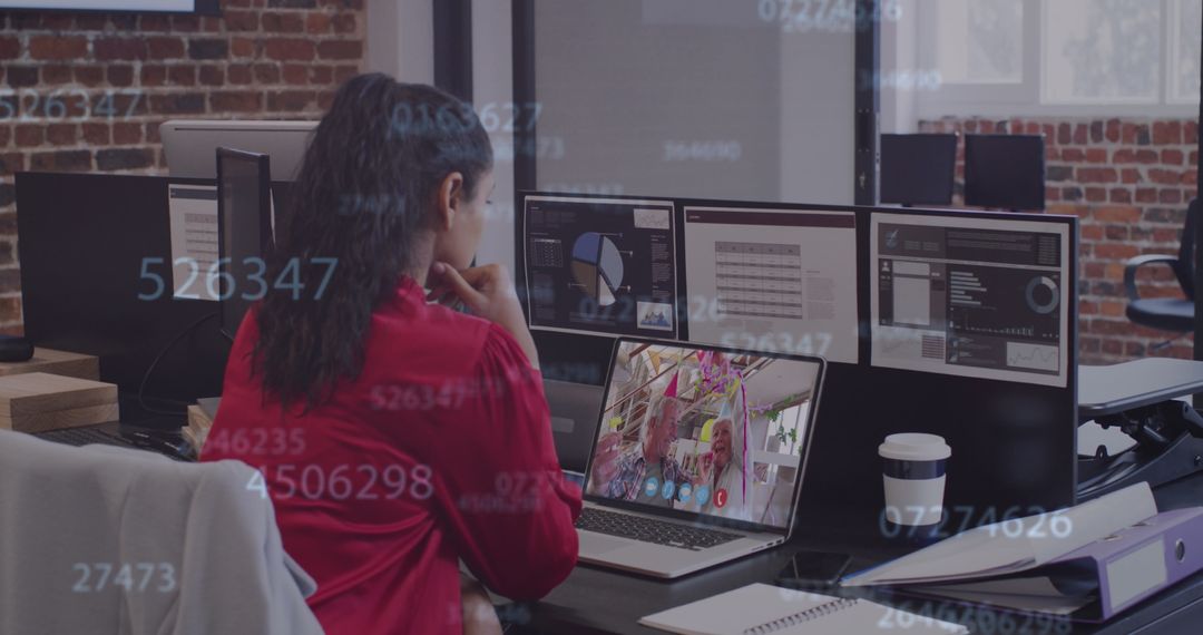 Woman in Red Video Conferencing with Digital Data Overlay