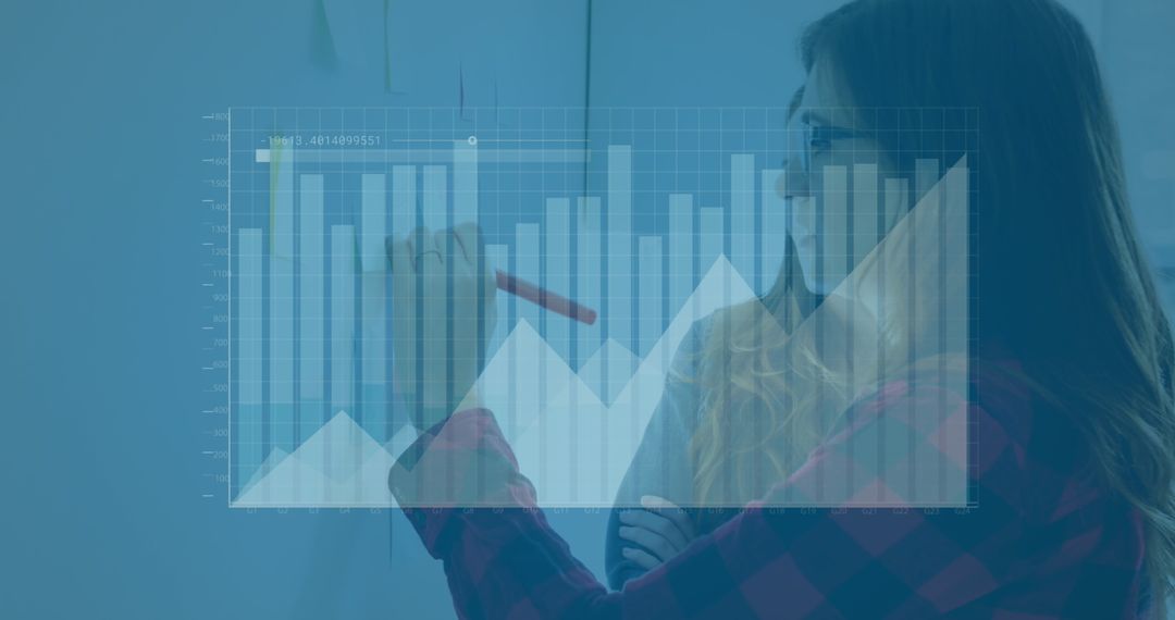 Woman Analyzing Financial Graph on Transparent Screen