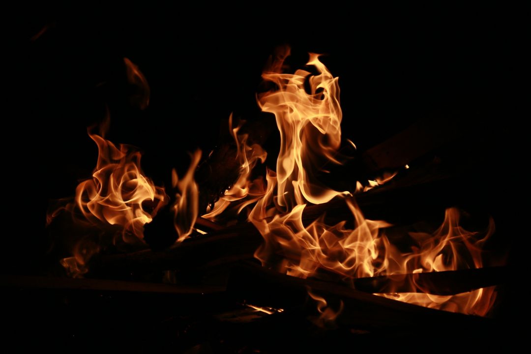 Close-up of Burning Flames in Dark Background - Free Images, Stock Photos and Pictures on Pikwizard.com