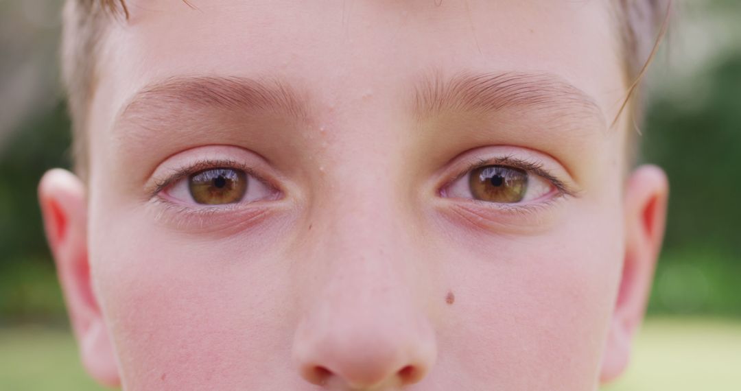 Close-Up of Boy's Face with Brown Eyes and Fair Skin - Free Images, Stock Photos and Pictures on Pikwizard.com