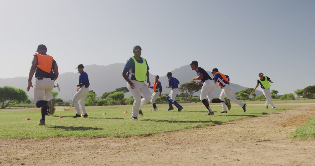 Baseball Players Training Outdoors on Sunny Day - Free Images, Stock Photos and Pictures on Pikwizard.com